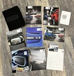 2011 Bmw X5M Owners Manual - Set With Case. Fixed Price $39.99.